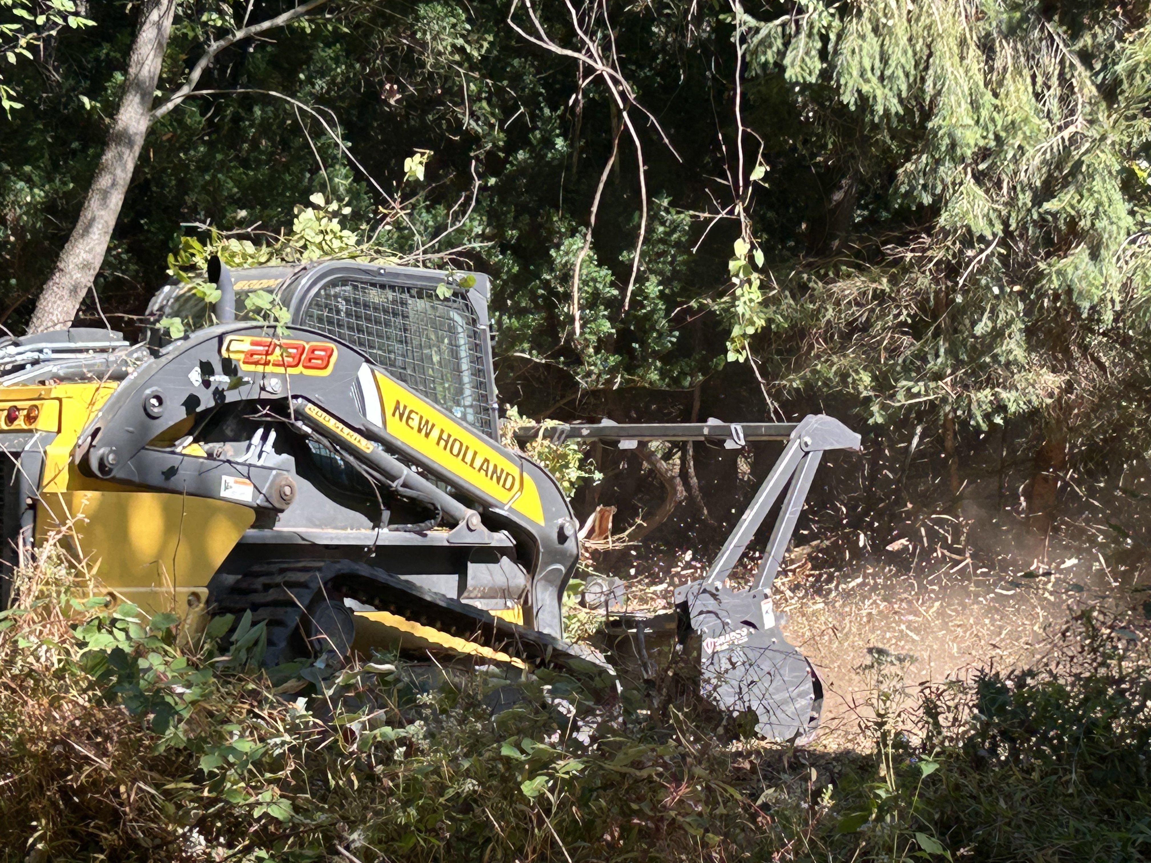 G5 Clearing skid loader with mulching attachment